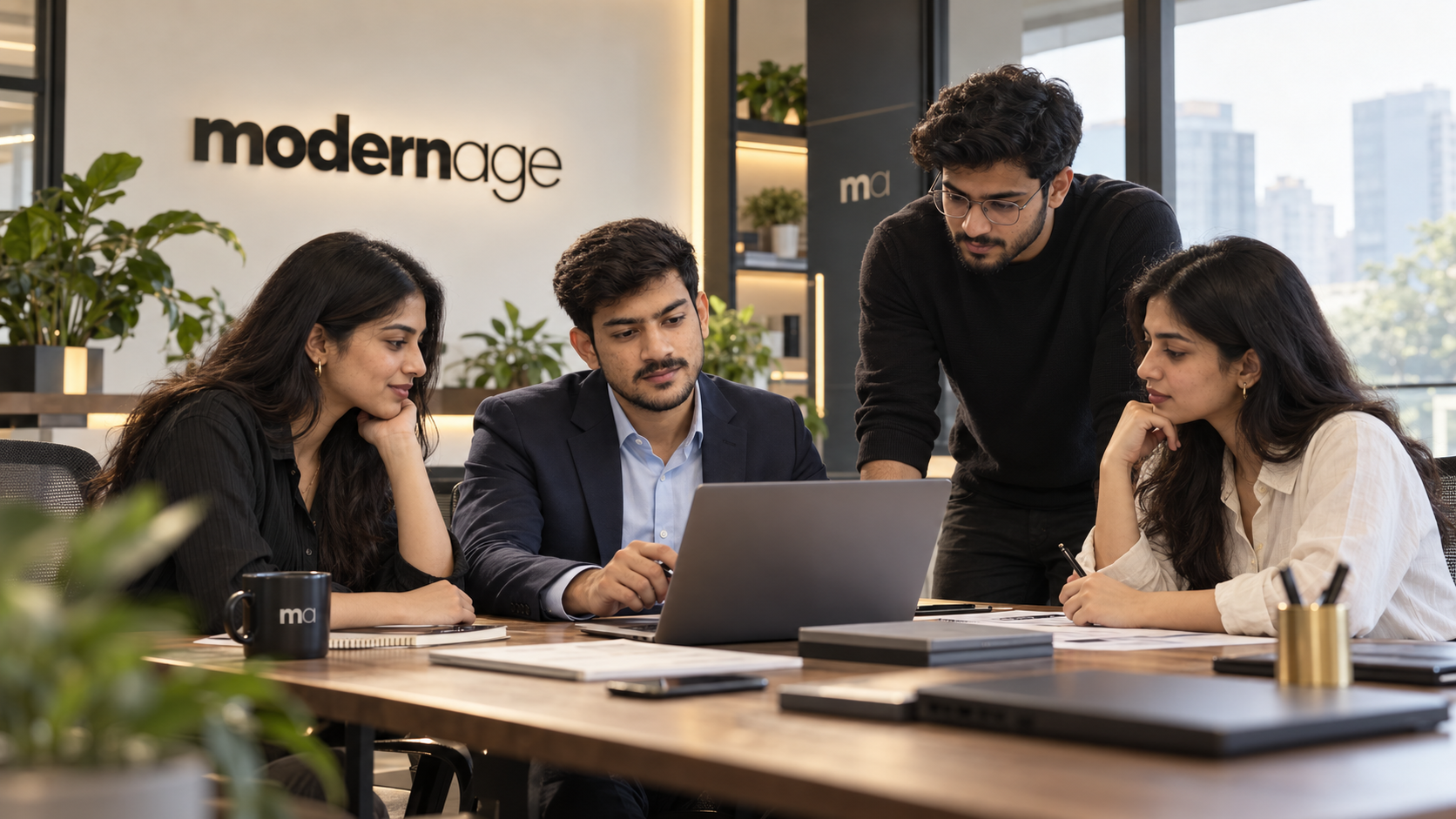 The Modern Age team working through a plan together at the studio table